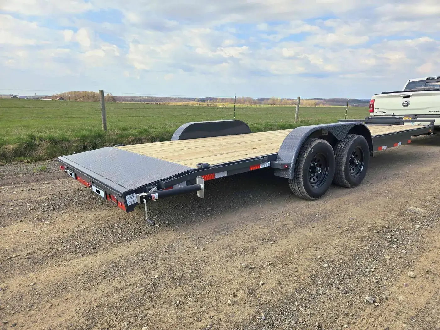 Lamar tilt-deck hauler with the deck lowered for loading, Poughquag NY