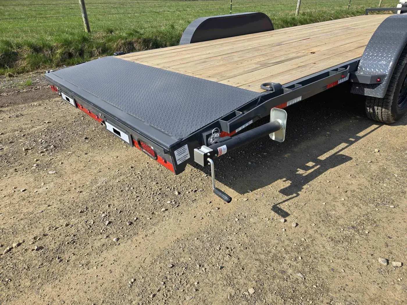 Adjustable coupler and jack on the Lamar tilt-deck hauler